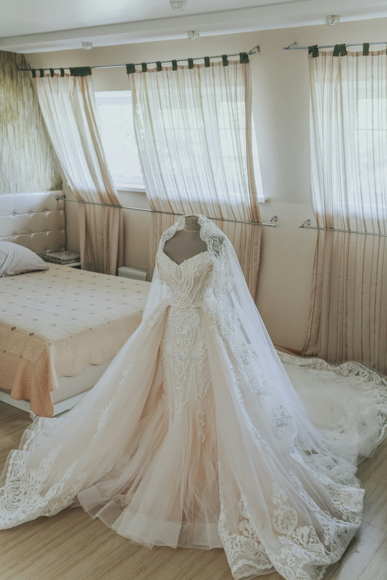 A wedding gown displayed on a mannequin, cleaned and preserved